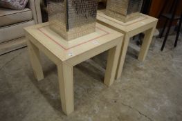 A pair of lamp or coffee tables.