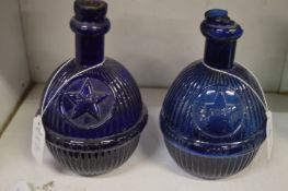 A pair of early Star blue glass fire extinguisher grenades.