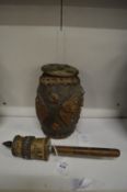 An Islamic prayer wheel and another item.