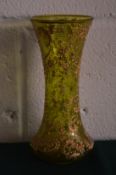 A green glass and gilt decorated vase.