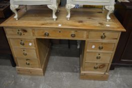 A pine pedestal desk.