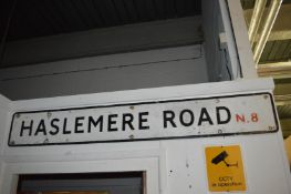 A road sign 'Haslemere Road N.8