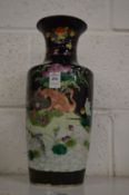 A 19th century Chinese famille noire vase.