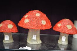 A set of three perspex mushrooms for illumination.