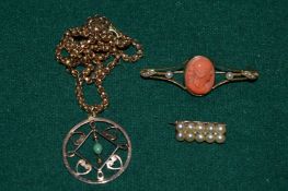 A 9ct gold curb link chain with yellow metal pendant and two brooches.