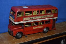 A tin plate London bus.