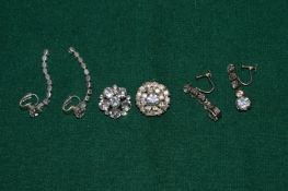 Three pairs of diamante earrings.