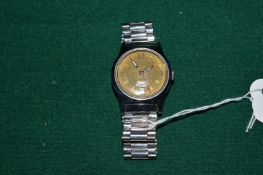 A gentlemans stainless steel wristwatch.