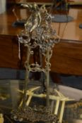 An ornate cast brass easel.
