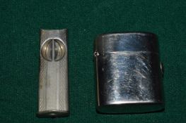A lighter and a cigar cutter.