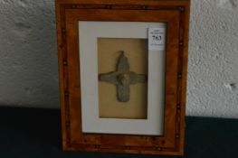 A bronze crucifix, framed and glazed.
