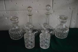 Three pairs of cut glass decanters (faults).