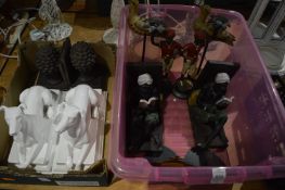 Various pairs of bookends and other decorative items.