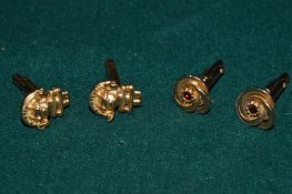 Two pairs of Columbian style cufflinks.