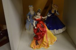 Three Royal Doulton figurines.