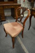 A Victorian walnut dining chair.