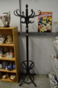 An ebonised coat stand.