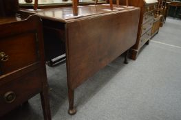 A 19th century mahogany rectangular drop-leaf gateleg dining table.