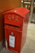 A reproduction cast iron post box.