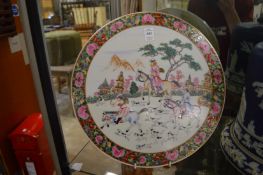 A pair of modern famille rose circular porcelain plaques.