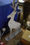 A painted steel model of a deer.