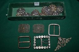 An early steel and paste set buckle, various other buckles and decorative items.