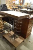 An unusual pine and wrought iron wine rack/work bench.