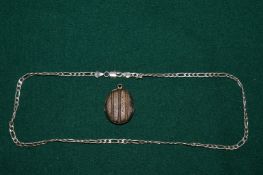 Silver necklace and a locket.