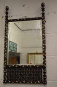 As Islamic mirror with mashrabiya work frame.