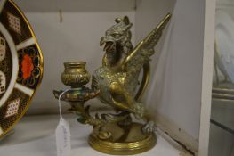 Cast brass Griffin candlestick.