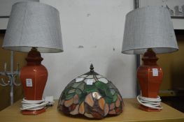 A pair of table lamps and a Tiffany style lamp shade.