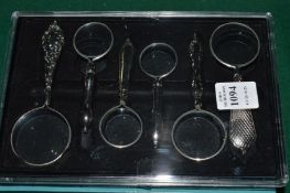 A box set of six miniature magnifying glasses.
