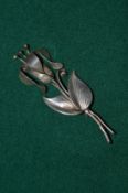 A Georg Jensen silver flower brooch.