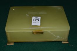 A Betjemann's patent onyx and brass cigarette box.