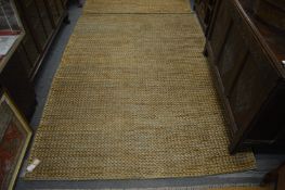 A modern Jute woven rug, 220cm x 155cm.
