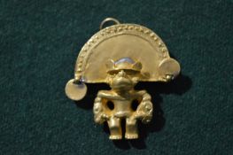 A Columbian style brooch.