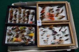Two cases containing fishing flies.