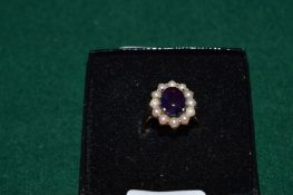 A 9ct gold cabochon amethyst and pearl ring.