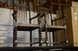 A pair of oak barley twist carver chairs.