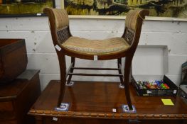 A mahogany dressing table seat.