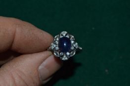 A silver ring set with a natural cabochon sapphire of 4.8ct with certificate.