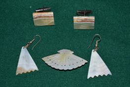 A pair of earrings, a brooch and a pair of cufflinks.