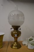 A brass oil lamp.