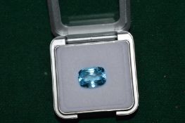 A natural 8ct cushion shaped blue topaz.