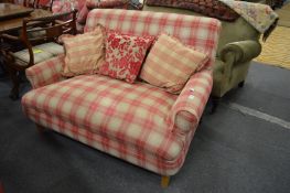 A modern check upholstered small two seater settee.