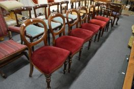 A set of four Victorian mahogany balloon back dining chairs and two similar chairs.