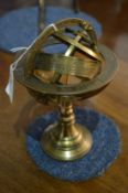 A brass model of a globe.