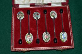 A cased set of six silver and enamel coffee spoons (very slight enamel loss to one spoon).