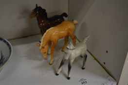 Three small Beswick horses.