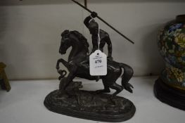 A Spelter figure group of an Indian brave on horseback being attacked by a tiger.